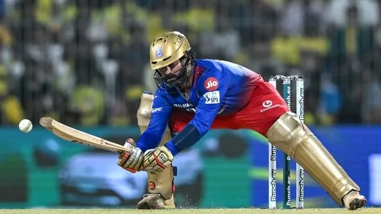 Batsman hitting six over boundary rope